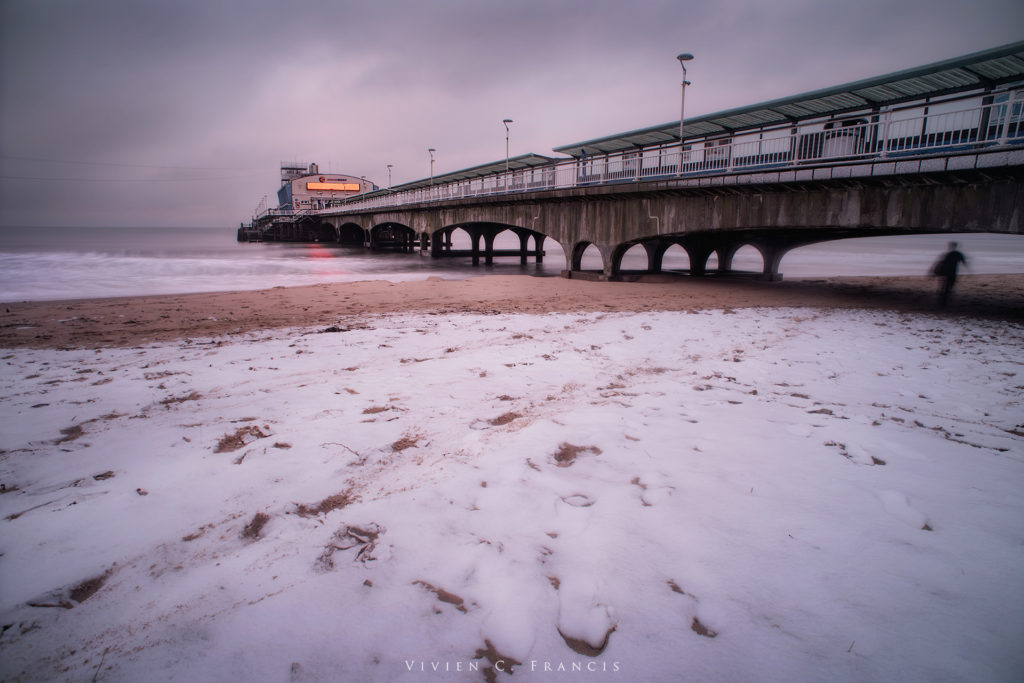 The pier and beach covered in snow