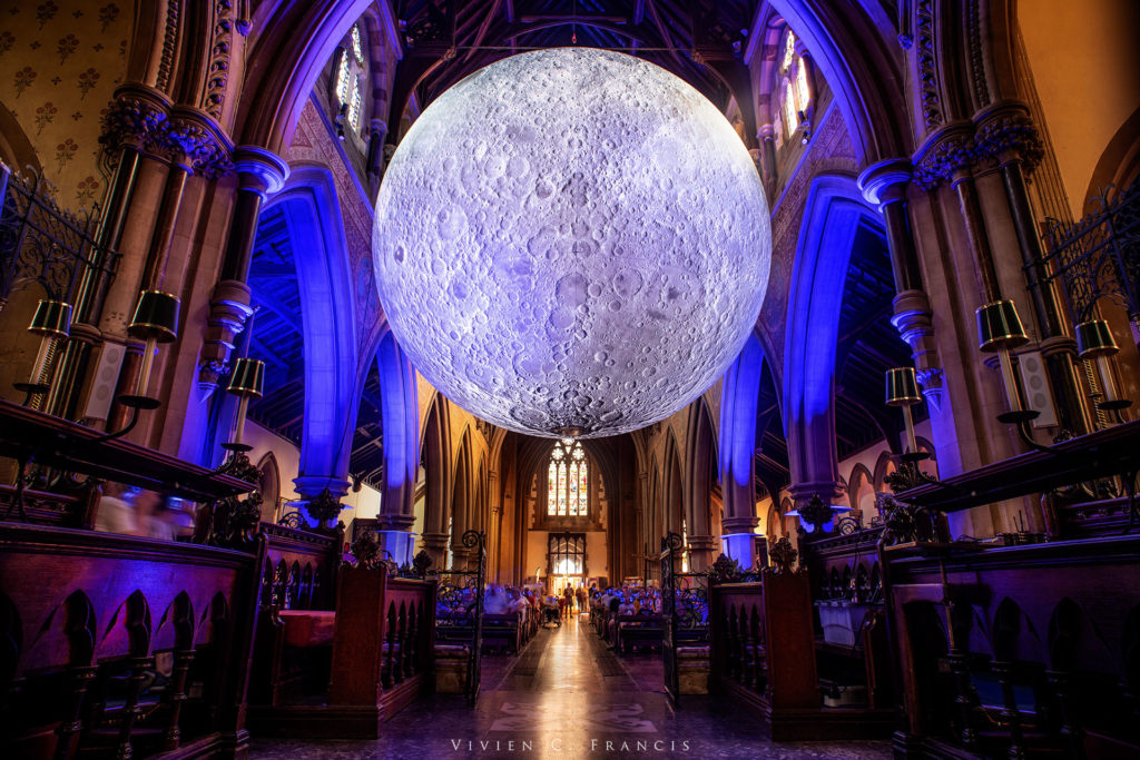 Moon art project floating in a church